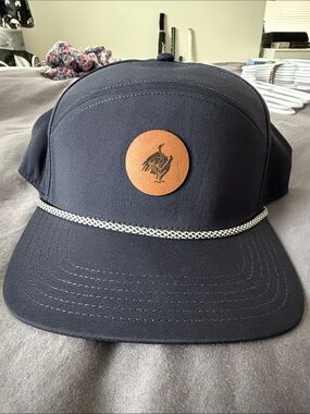 Navy Snapback Cap with Tan Leather Logo Patch